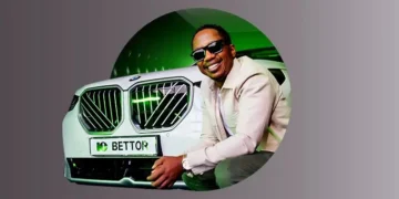 Andile Ncube standing next to the bmw x3