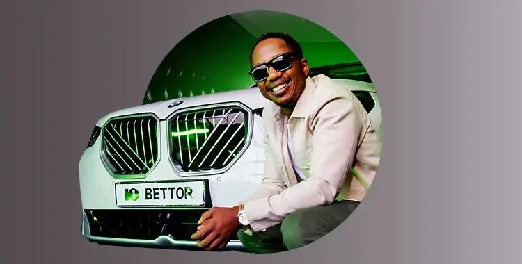 Andile Ncube standing next to the bmw x3